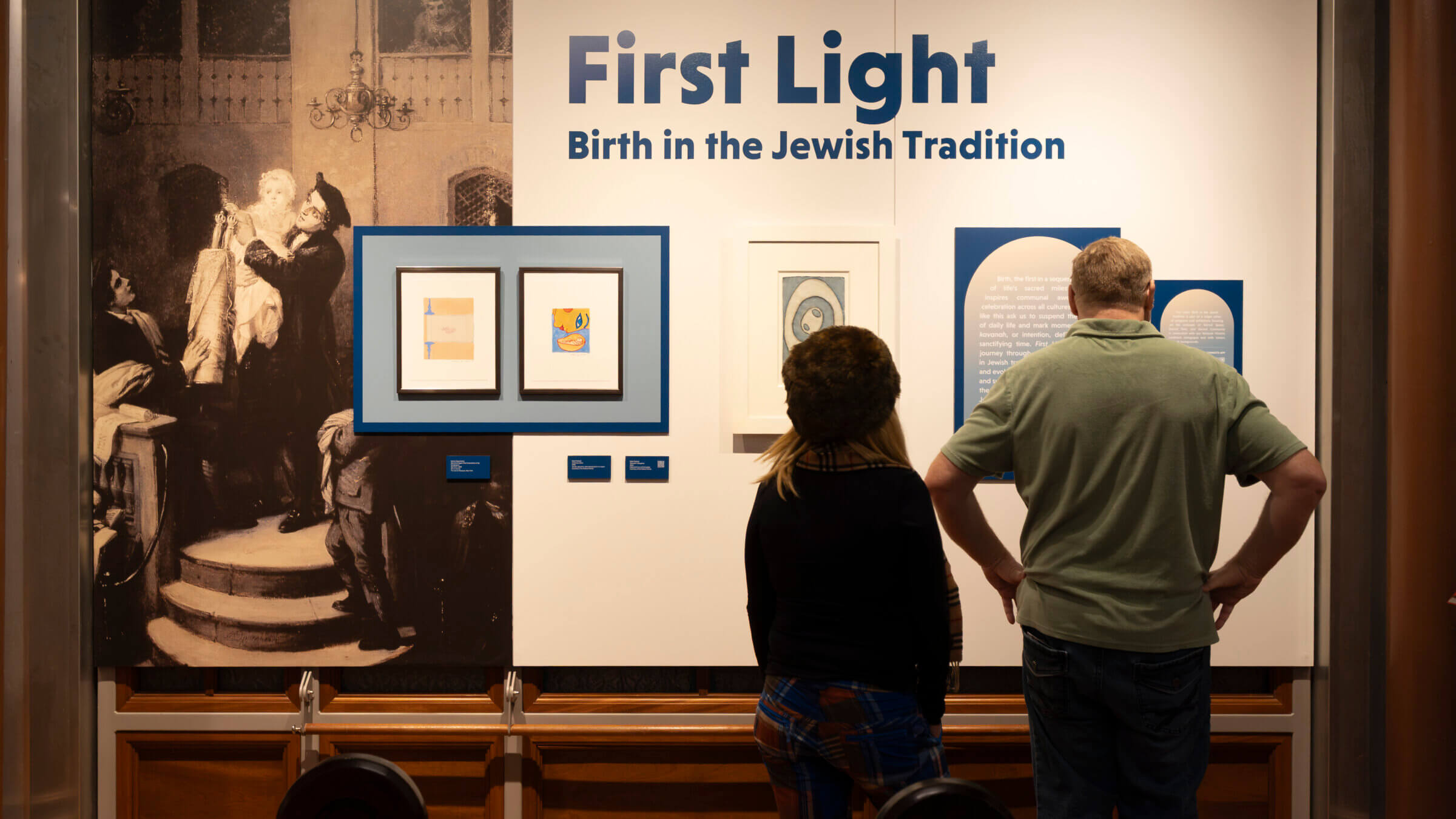 Visitors at the exhibition opening of <i>First Light: Birth in the Jewish Tradition</i>.