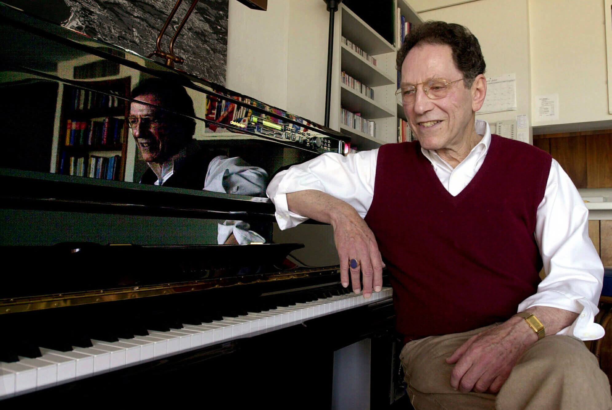 Tom Lehrer sits beside the piano in his house in Santa Cruz, California, in 2000.