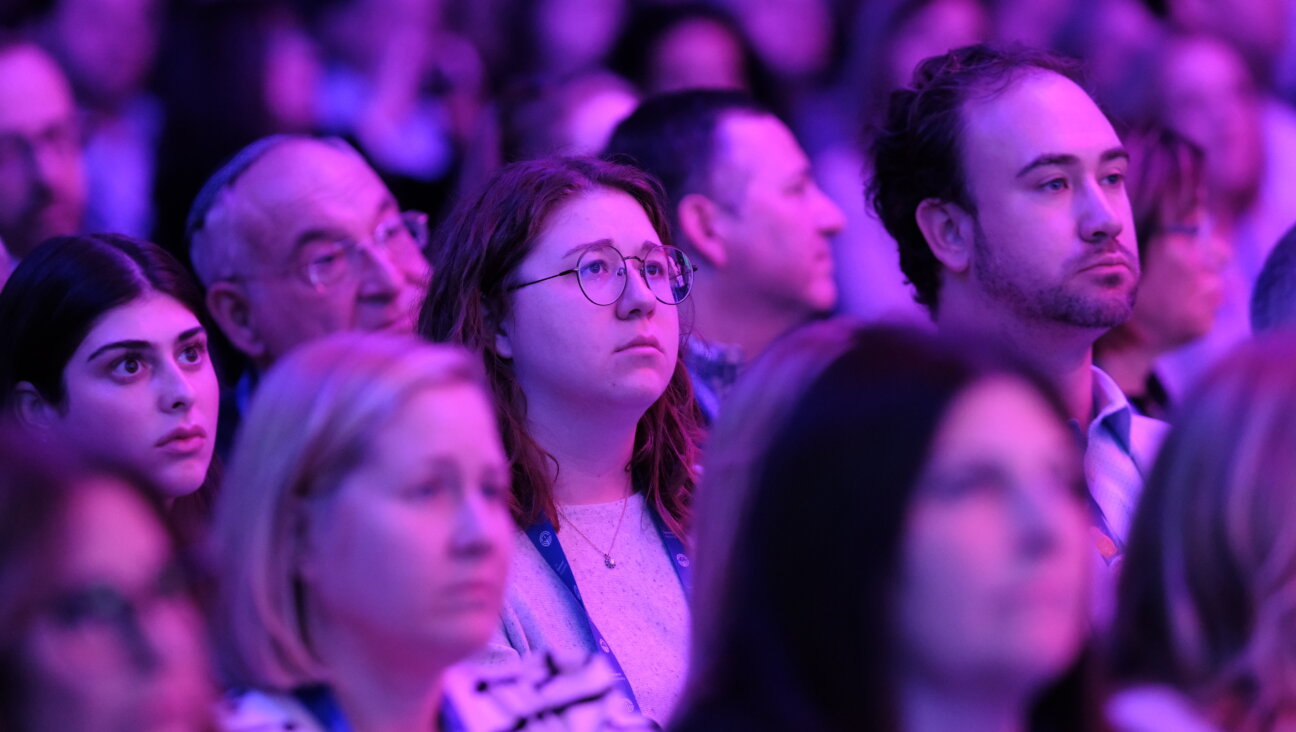 Audience members watch the opening plenary of the Jewish Federations of North America's annual conference in Washington, D.C., on Sunday.