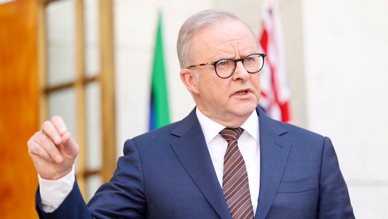 Australia’s Prime Minister Anthony Albanese speaks to the media at Parliament House on December 19, 2025 in Canberra, Australia. 