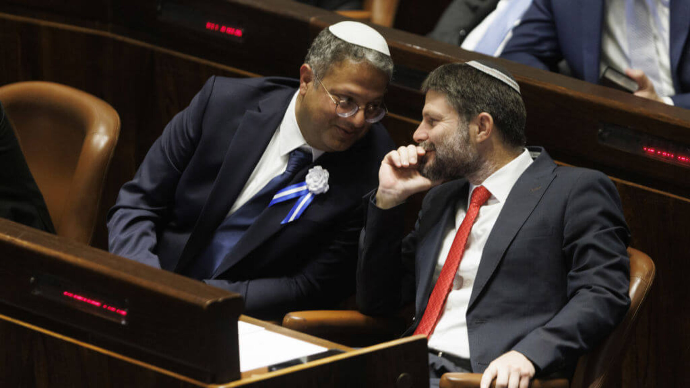 The two most controversial new members of Benjamin Netanyahu's new government: Itamar Ben Gvir, lawmaker and leader of the Otzma Yehudit party, <i>left</i>, speaks with Bezalel Smotrich, lawmaker and leader of the Religious Zionist party, during a swearing in ceremony at the Knesset in Jerusalem Nov. 15. 