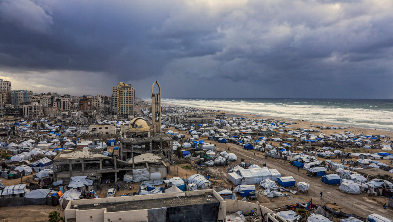 Tent shelters housing displaced Palestinian families set up along the shore in Gaza City on Jan. 13.