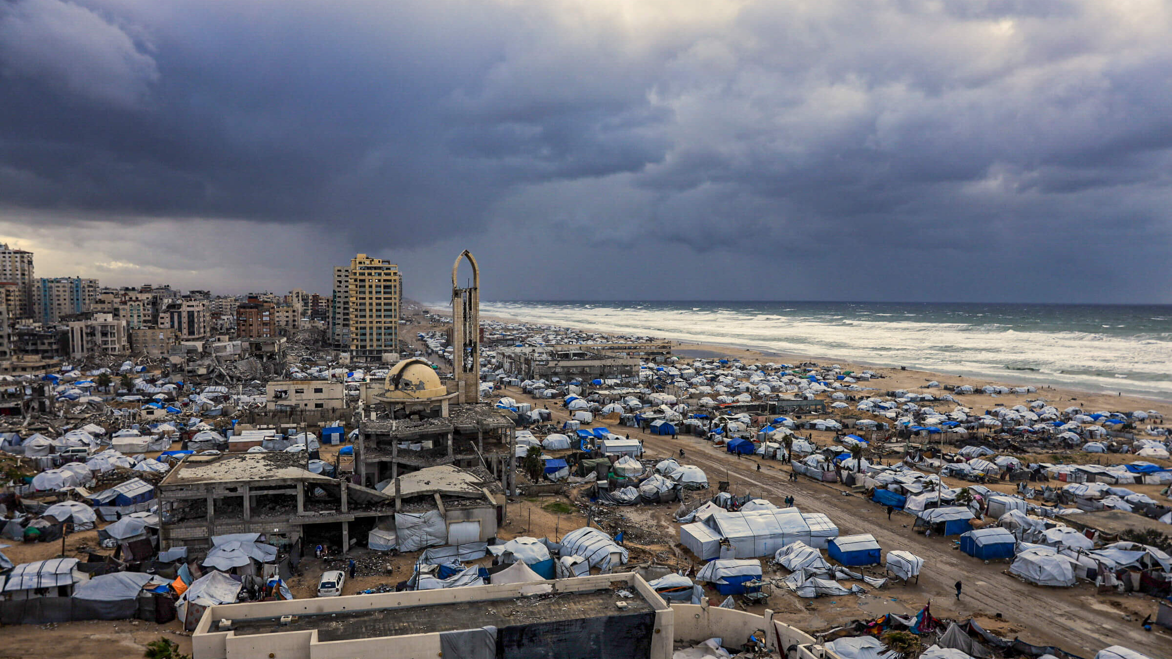 Tent shelters housing displaced Palestinian families set up along the shore in Gaza City on Jan. 13.