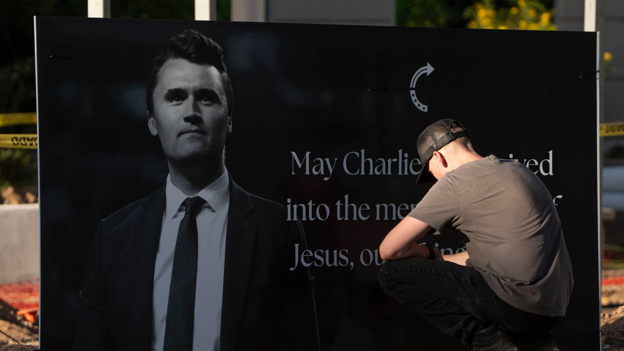 A man mourns Turning Point USA Founder Charlie Kirk outside of the Turning Point USA headquarters in Phoenix after Kirk was shot and killed on Sept. 10.