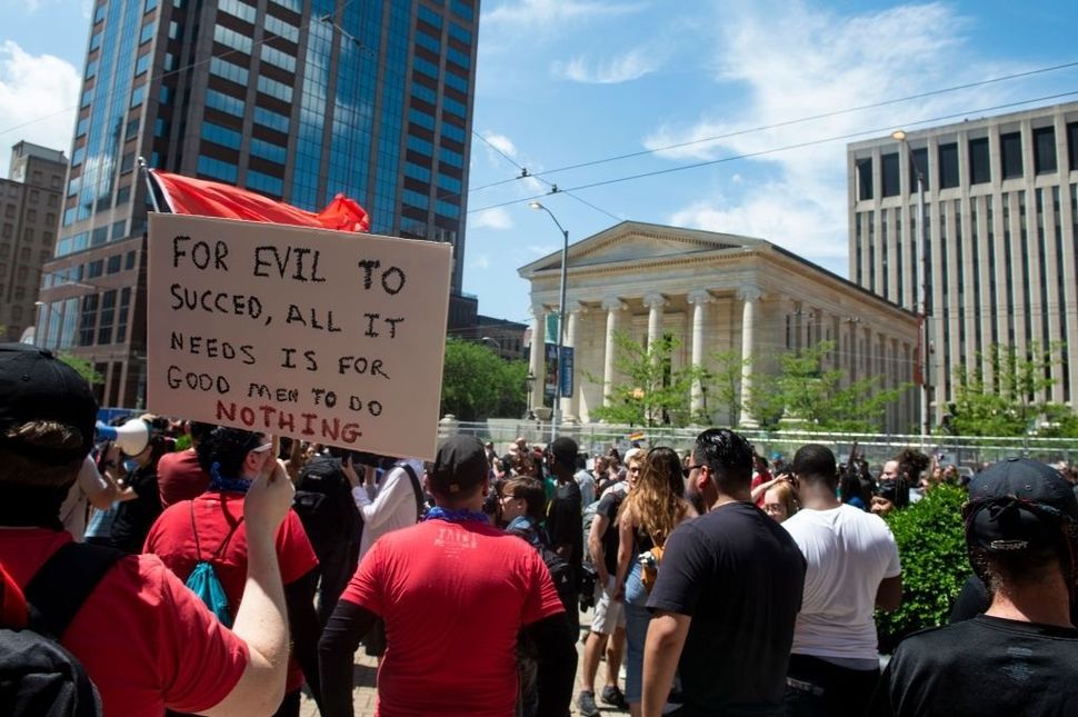 Counter-protesters gather en masse to protest against a rally held by the KKK-affiliated group Honorable Sacred Knights of Indiana on May 25, 2019 in Dayton, Ohio.