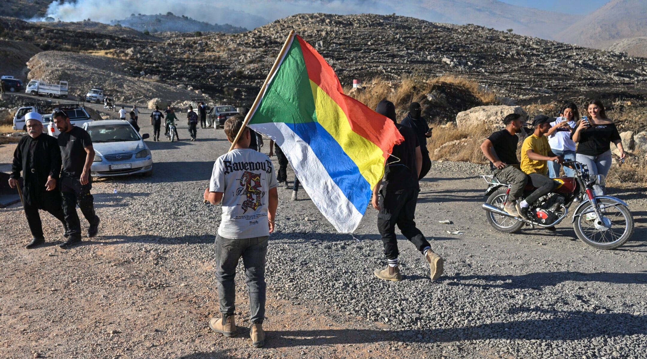 Druze residents protest near the Israeli-Syrian border fence in solidarity with their community in Syria, July 16, 2025. (Michael Giladi/Flash90)