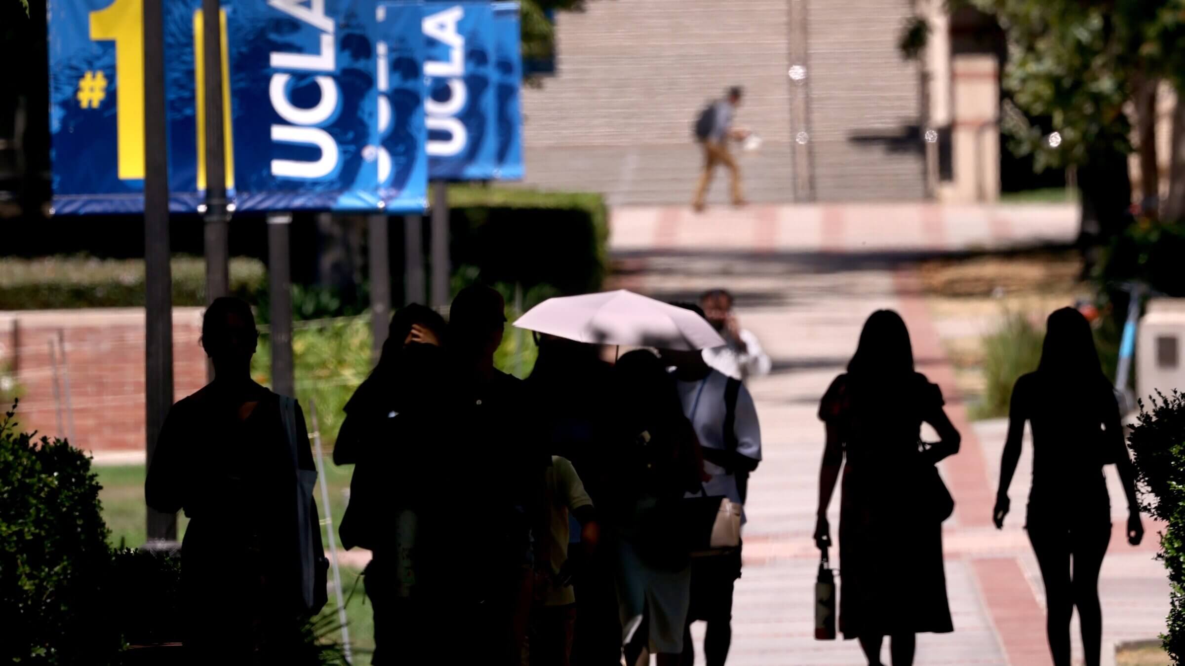 Students and visitors make their way on the UCLA campus in August.