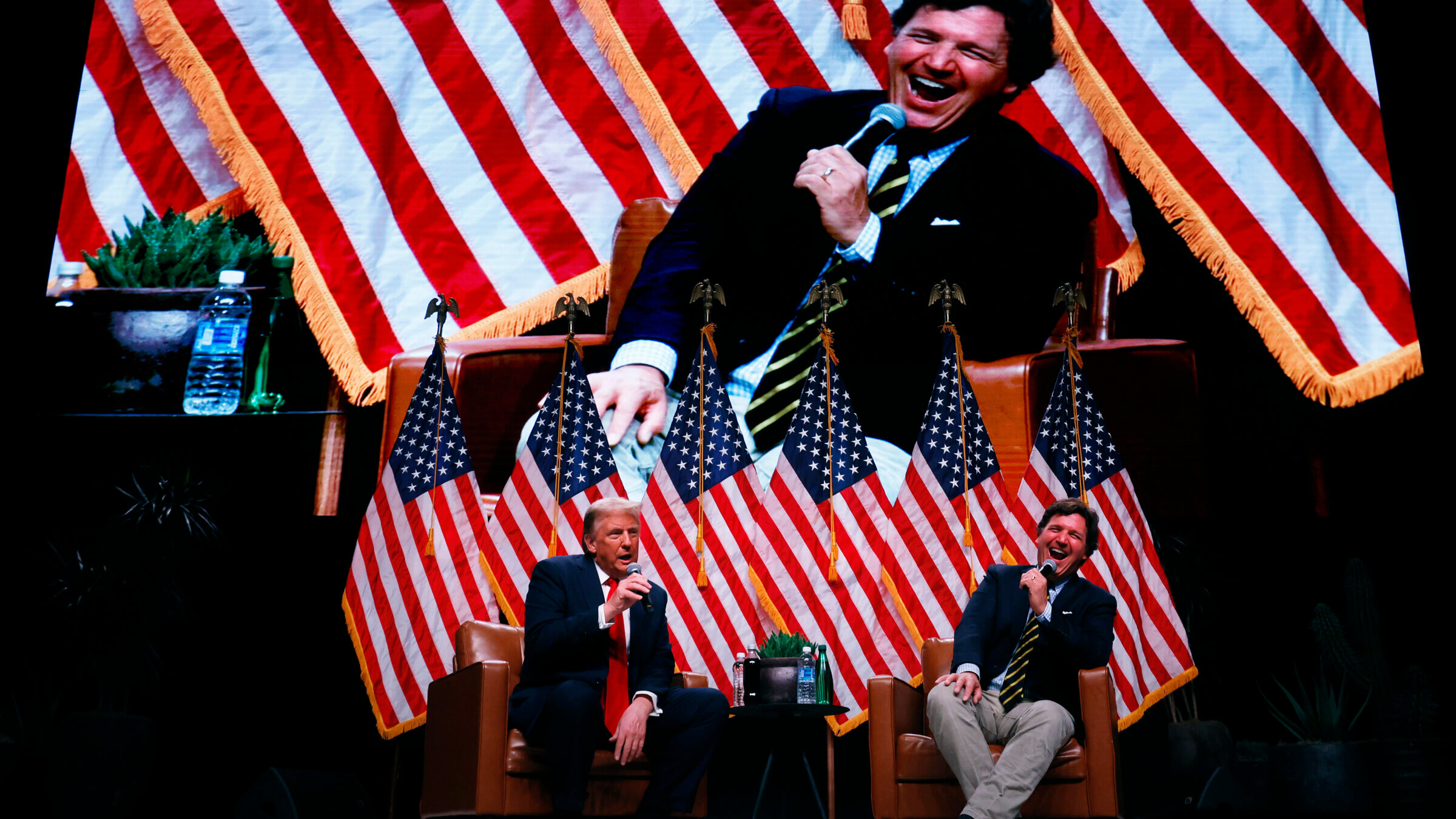 President Donald Trump sits down for a conversation with Tucker Carlson during his Live Tour at the Desert Diamond Arena on October 31, 2024.