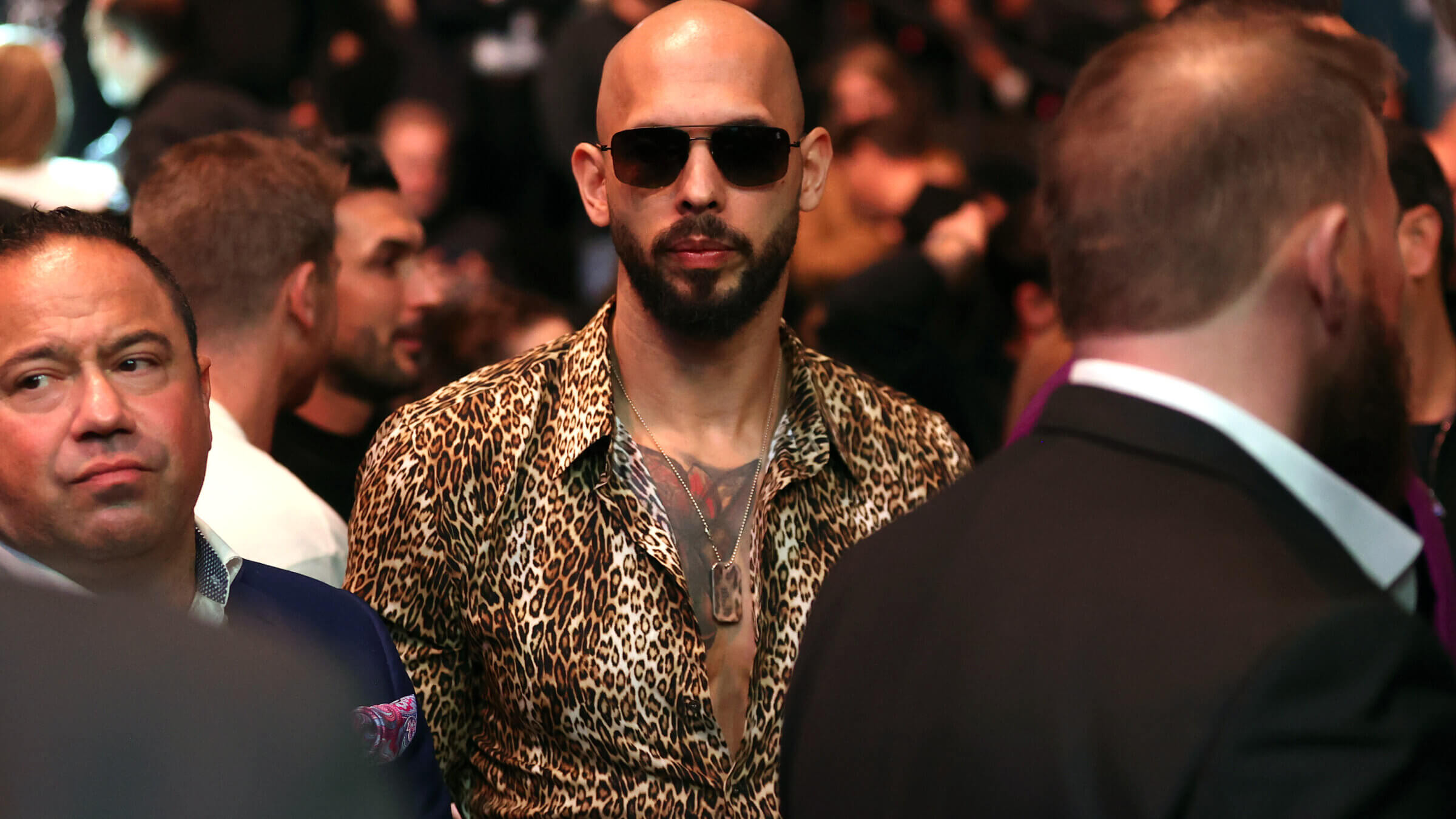 Influencer Andrew Tate attends a mixed martial arts fight on March 8 in Las Vegas after the Trump administration helped free him from Romania where he is face sex trafficking and rape charges.