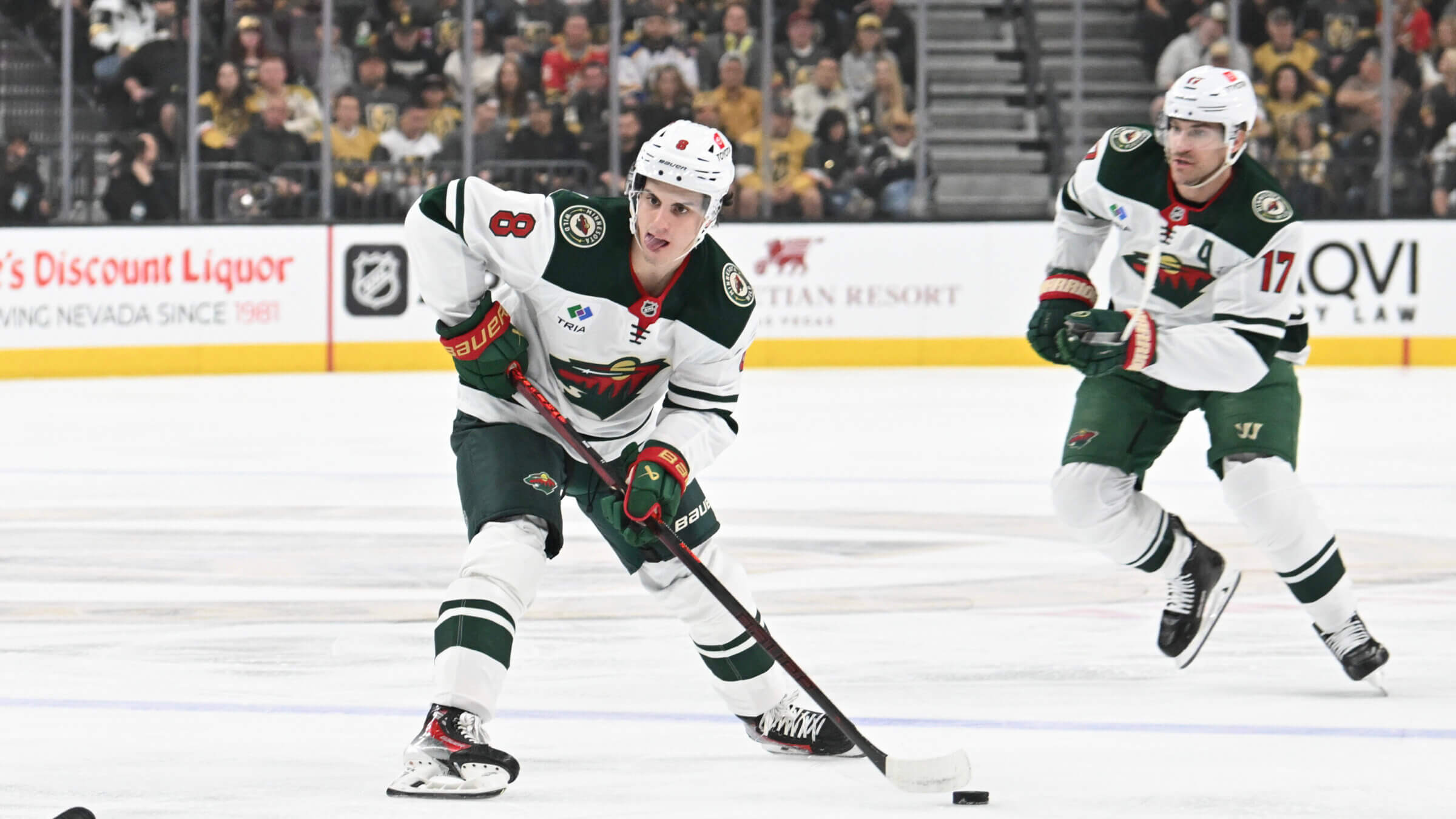 Zeev Buium (No. 8) of the Minnesota Wild skates with the puck against the Vegas Golden Knights in the first period of Game One of the First Round of the 2025 Stanley Cup Playoffs at T-Mobile Arena on April 20, 2025 in Las Vegas. The Golden Knights defeated the Wild 4-2.