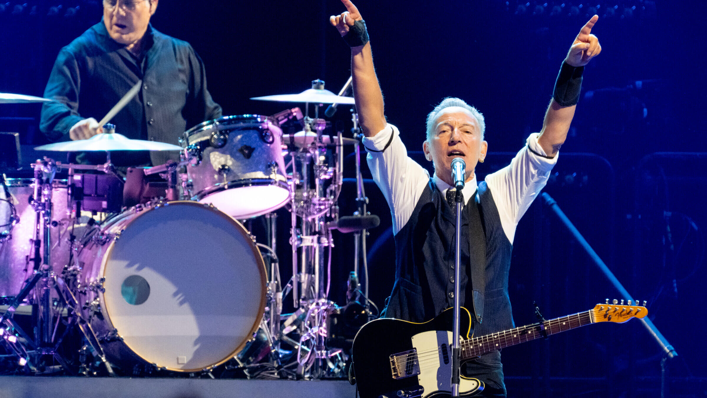 Bruce Springsteen and Max Weinberg performing in Manchester, England.
