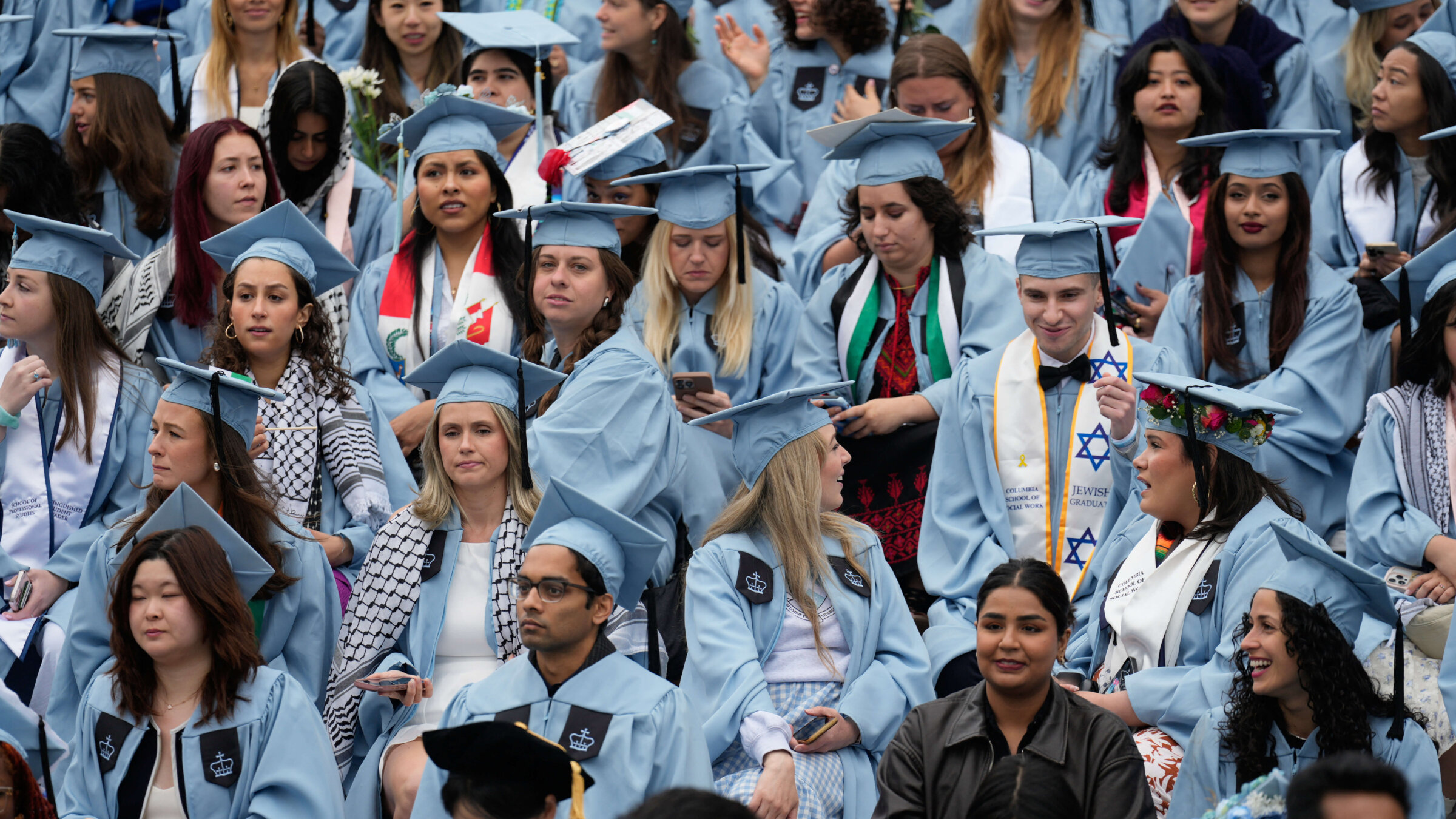Students look on during the Commencement Ceremony at Columbia University in New York on May 21, 2025.
