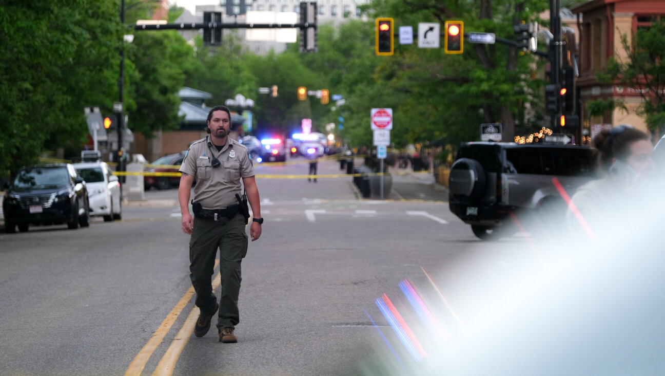 A police officer walks on Pearl street, the site of an attack on demonstrators calling for the release of Israeli hostages held in Gaza, in Boulder, Colorado, on June 1.