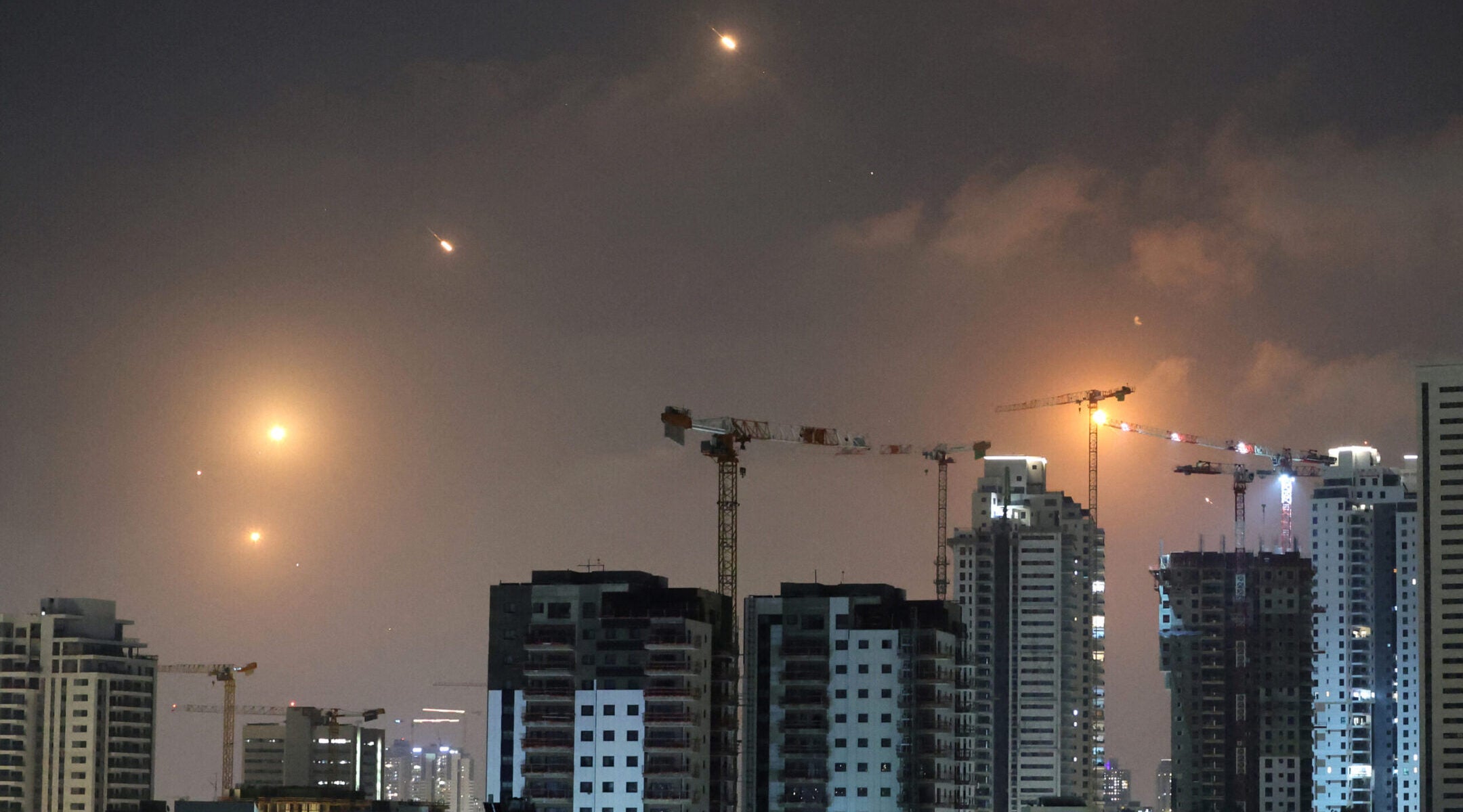This picture shows rocket trails in the sky above Netanya, Israel, on June 13, 2025. (Jack Guez/AFP via Getty Images)