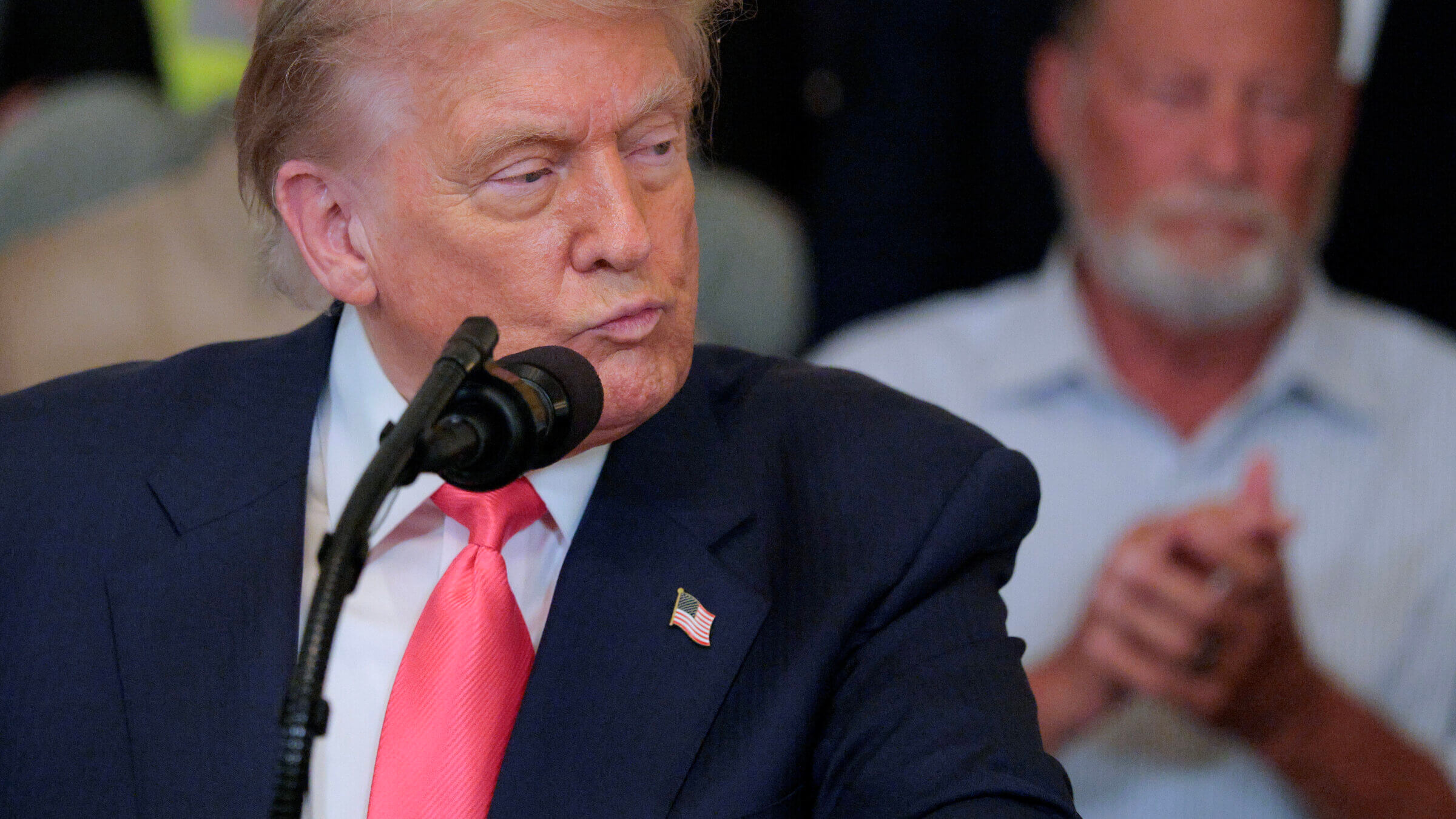 Donald Trump delivers remarks in the East Room of the White House.