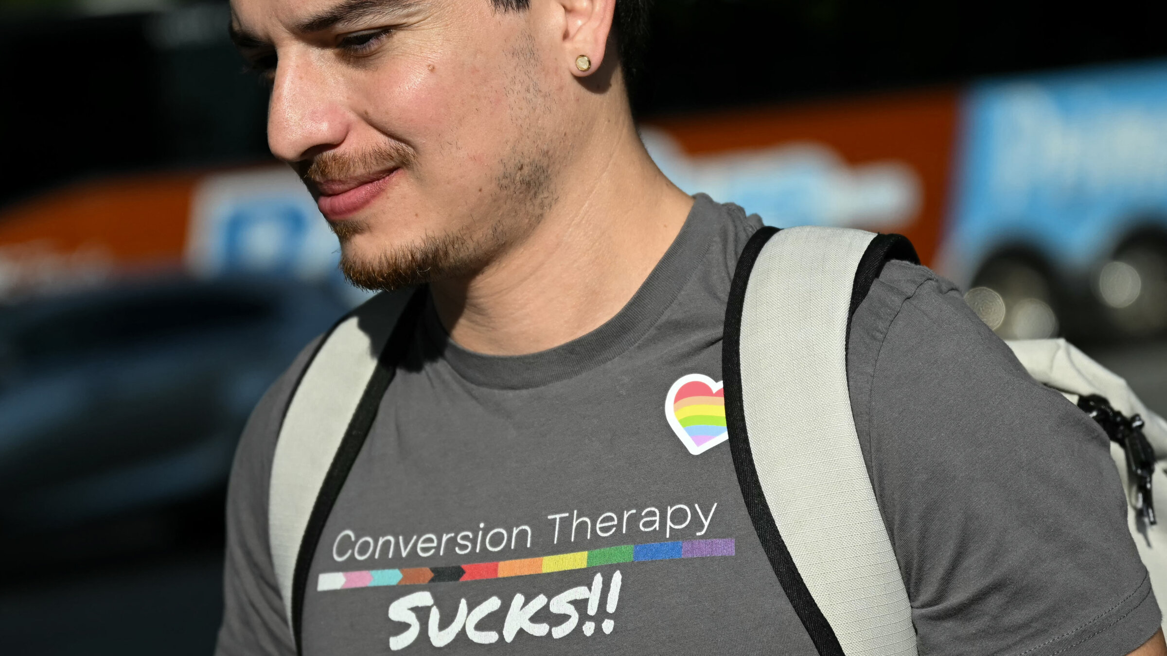 A man wears a shirt reading "conversion therapy sucks" outside the US Supreme Court as the Court hears oral arguements in Chiles v. Salazar, a landmark case on conversion therapy, Oct. 7.