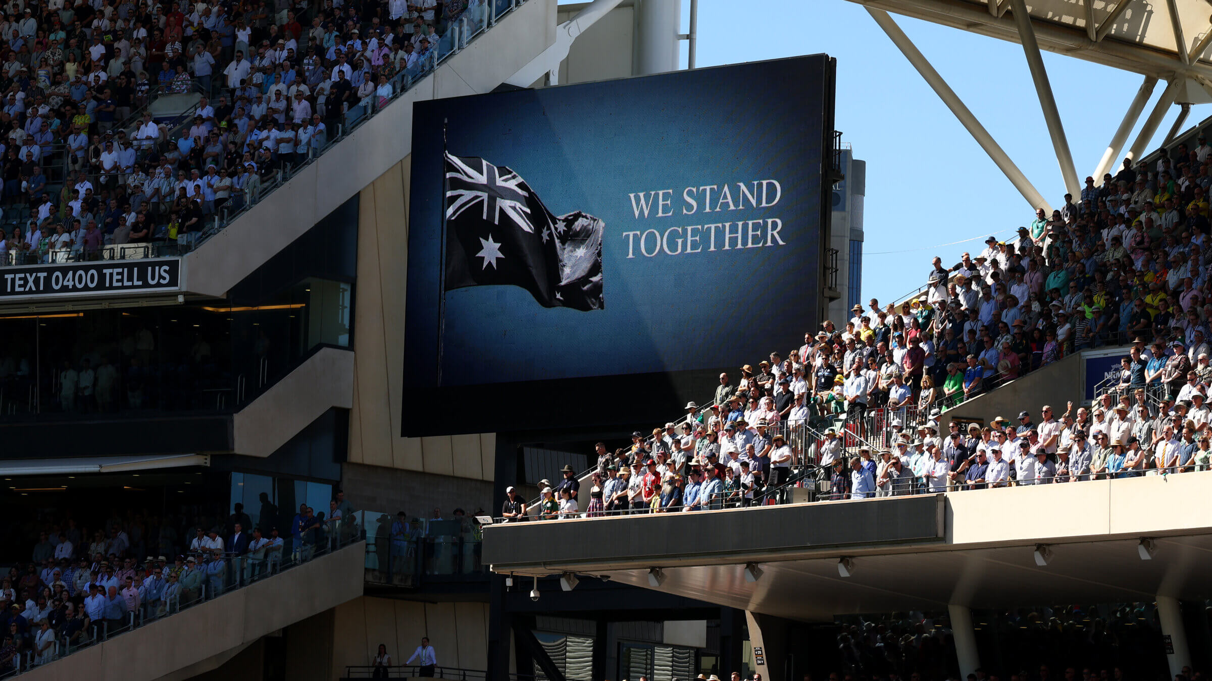 A message on display during a moment of silence to pay respects to the victims of the Bondi shootings during day one of the Ashes Series between Australia and England at Adelaide Oval on December 17, 2025 in Adelaide, Australia.