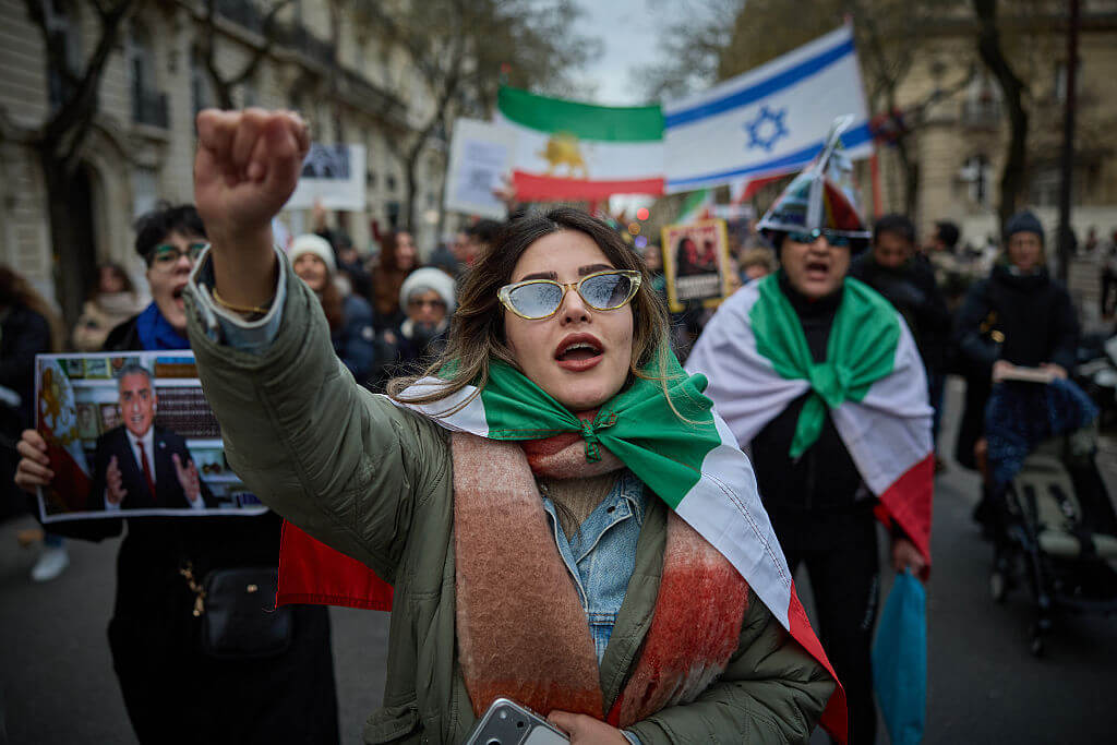 Protestors shout slogans during a demonstration to support mass rallies denouncing the Islamic republic in Iran in Paris on January 11, 2026. 
