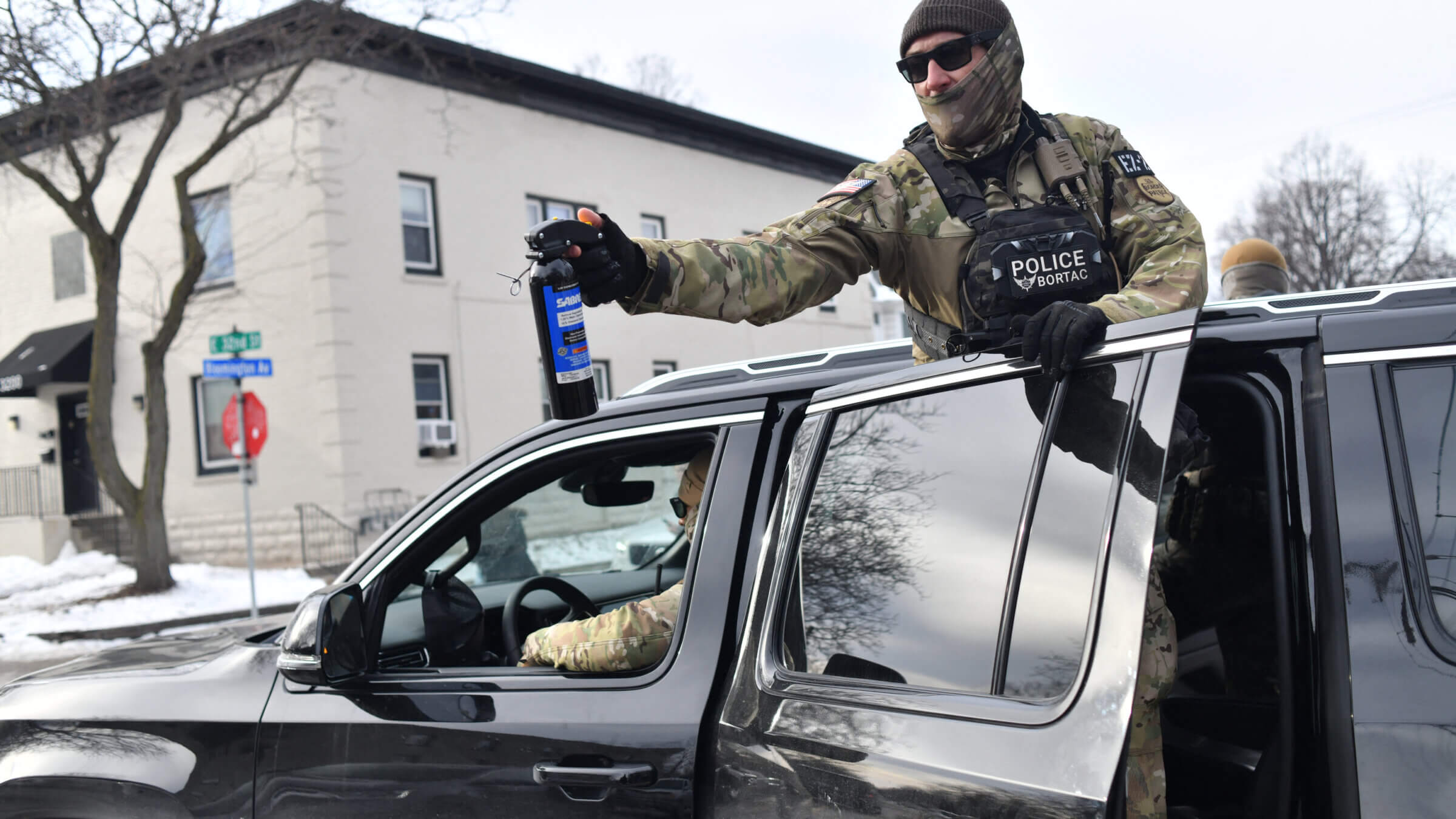 ICE agents patrol a neighborhood during immigration enforcement activity in Minneapolis 
