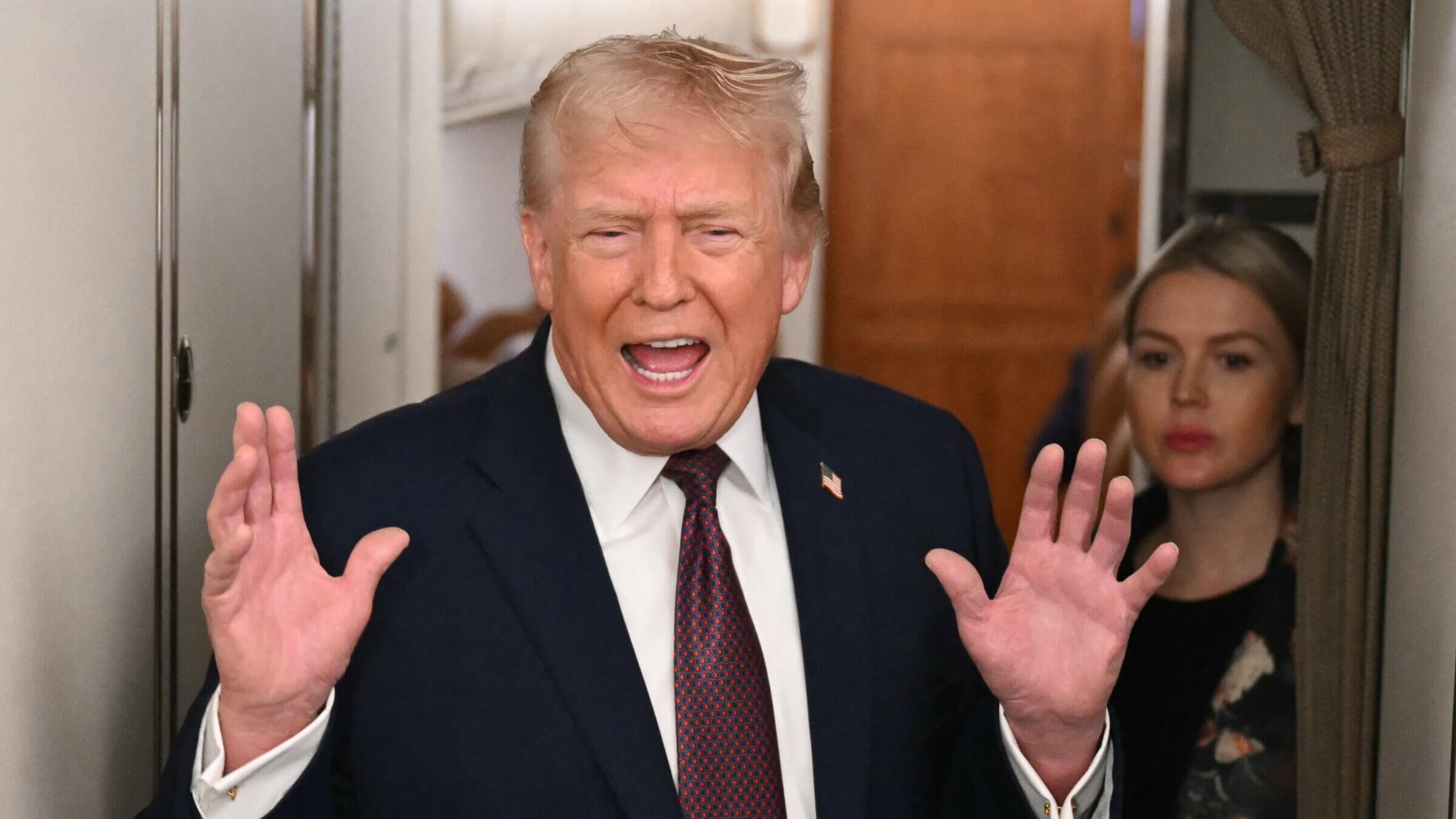 Donald Trump speaks to the press aboard Air Force One Jan. 11.