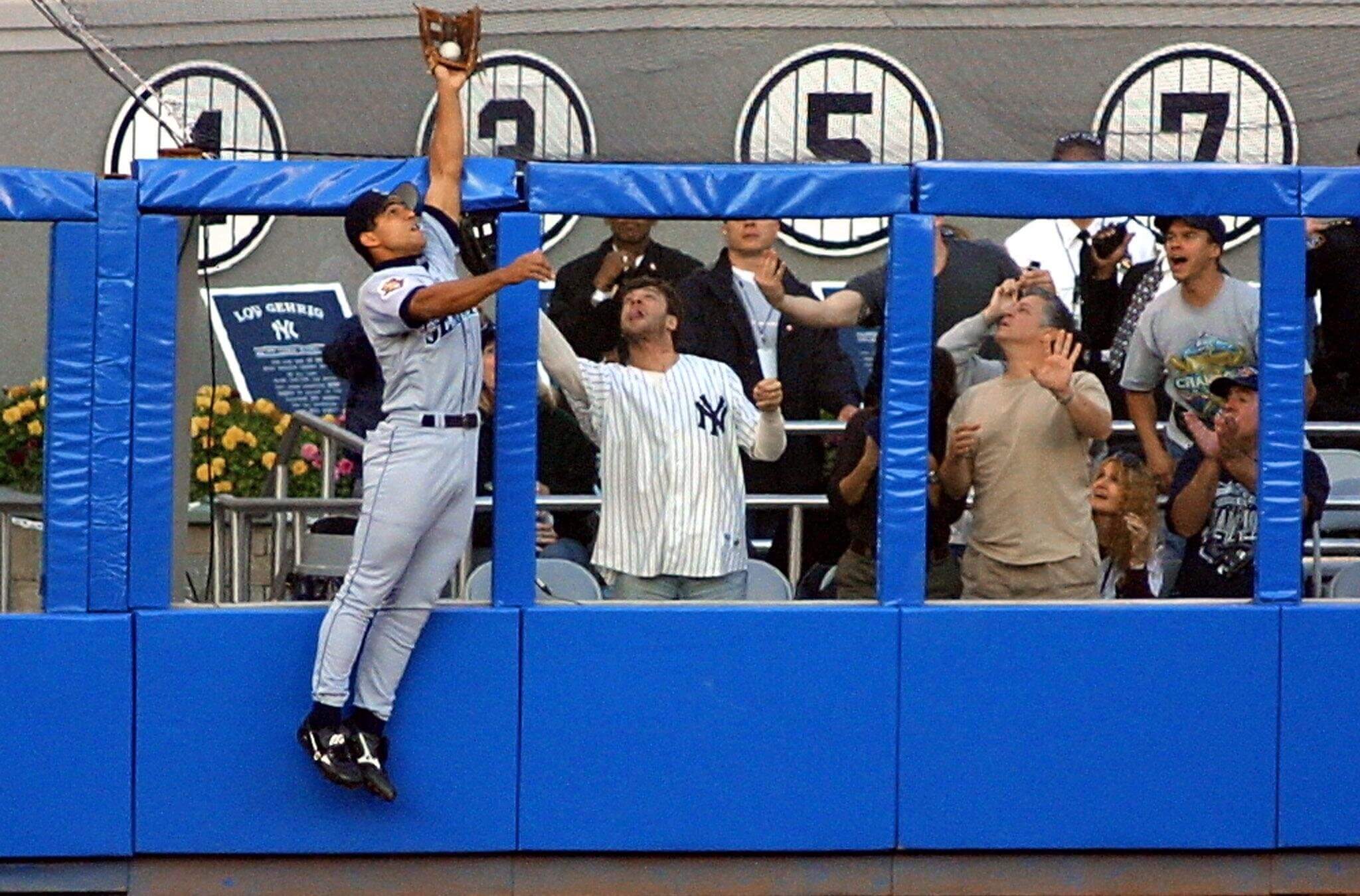 Seattle Mariner Stan Javier robs Alfonso Soriano of a home run — and the author of this article (pictured in Yankees jersey) of a souvenir.