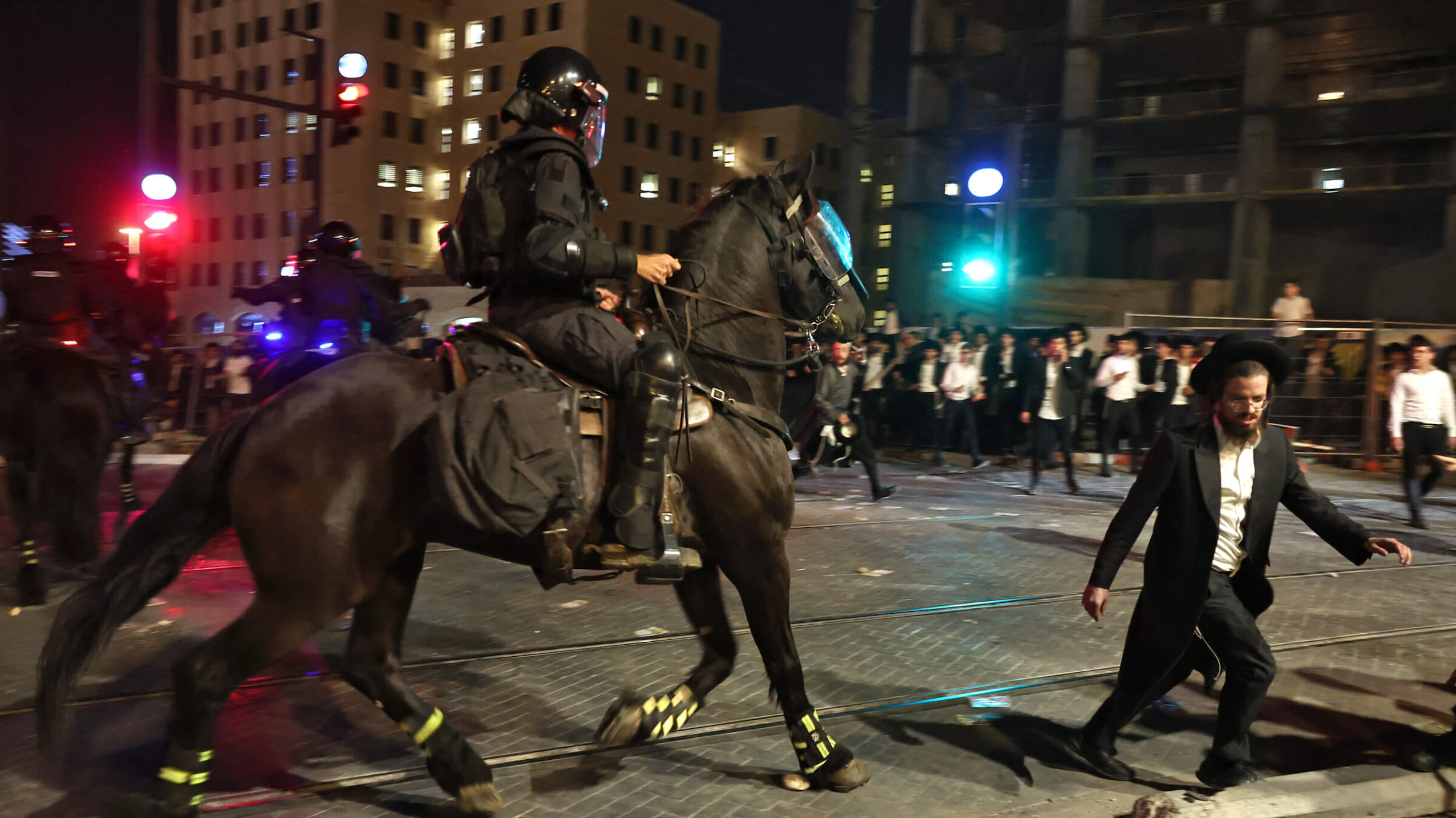 Israeli mounted police disperse Haredi Jewish men during a protest against conscription into Israel's military in Jerusalem on Oct. 30.