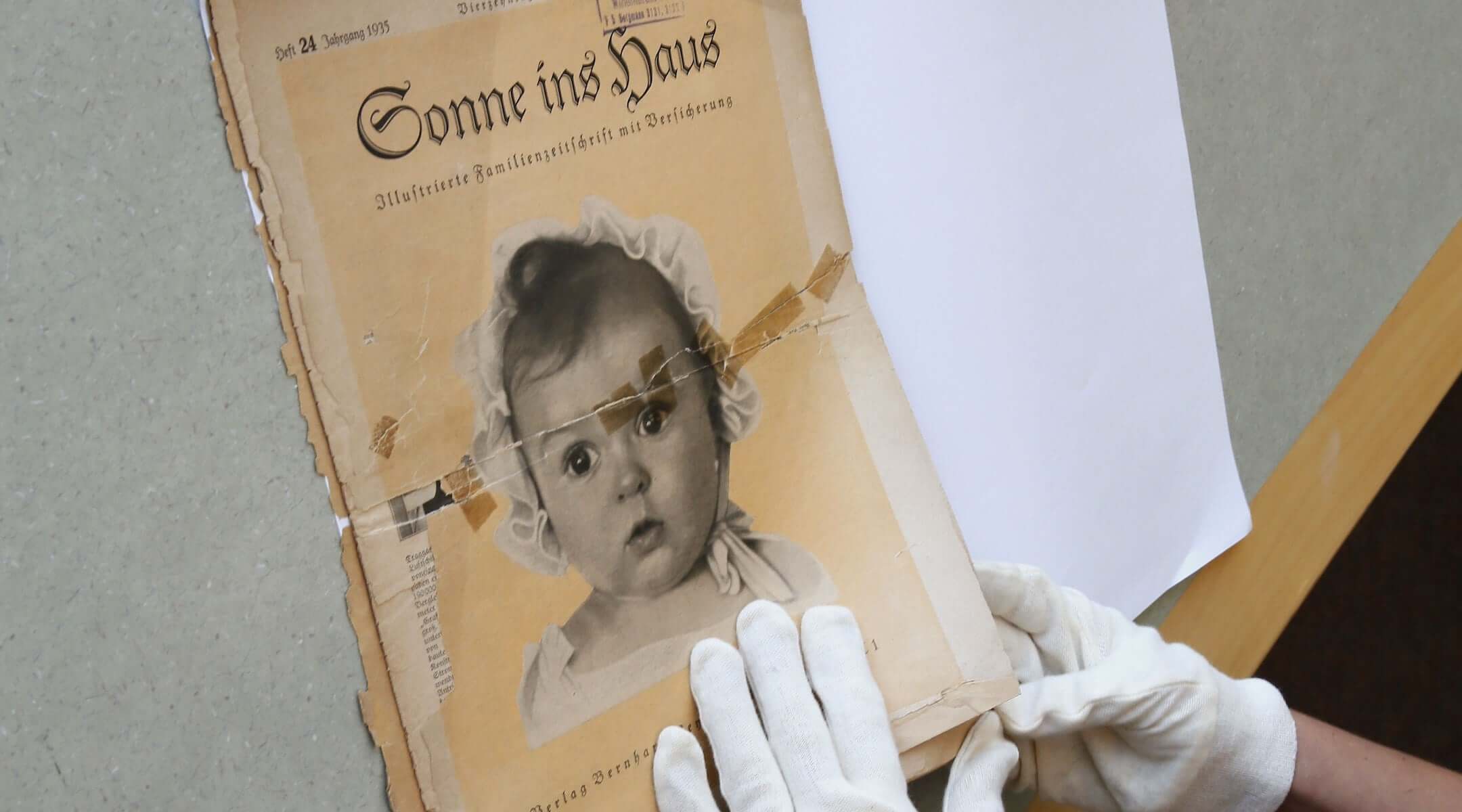 At the archives of the Yad Vashem Holocaust memorial museum, the front page of the original issue of the Nazi family magazine 'Sonnie ins Hous' (Sunshine in the House) shows baby Hessy Taft as the ideal German Aryan baby. Taft was Jewish.