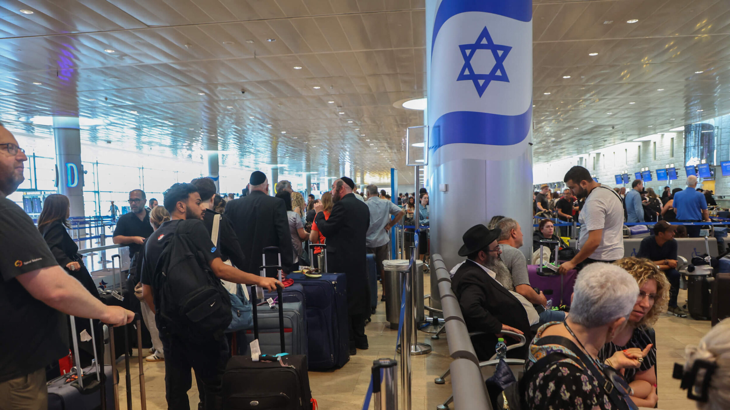Passengers wait for flights at the Ben-Gurion Airport in Tel Aviv.