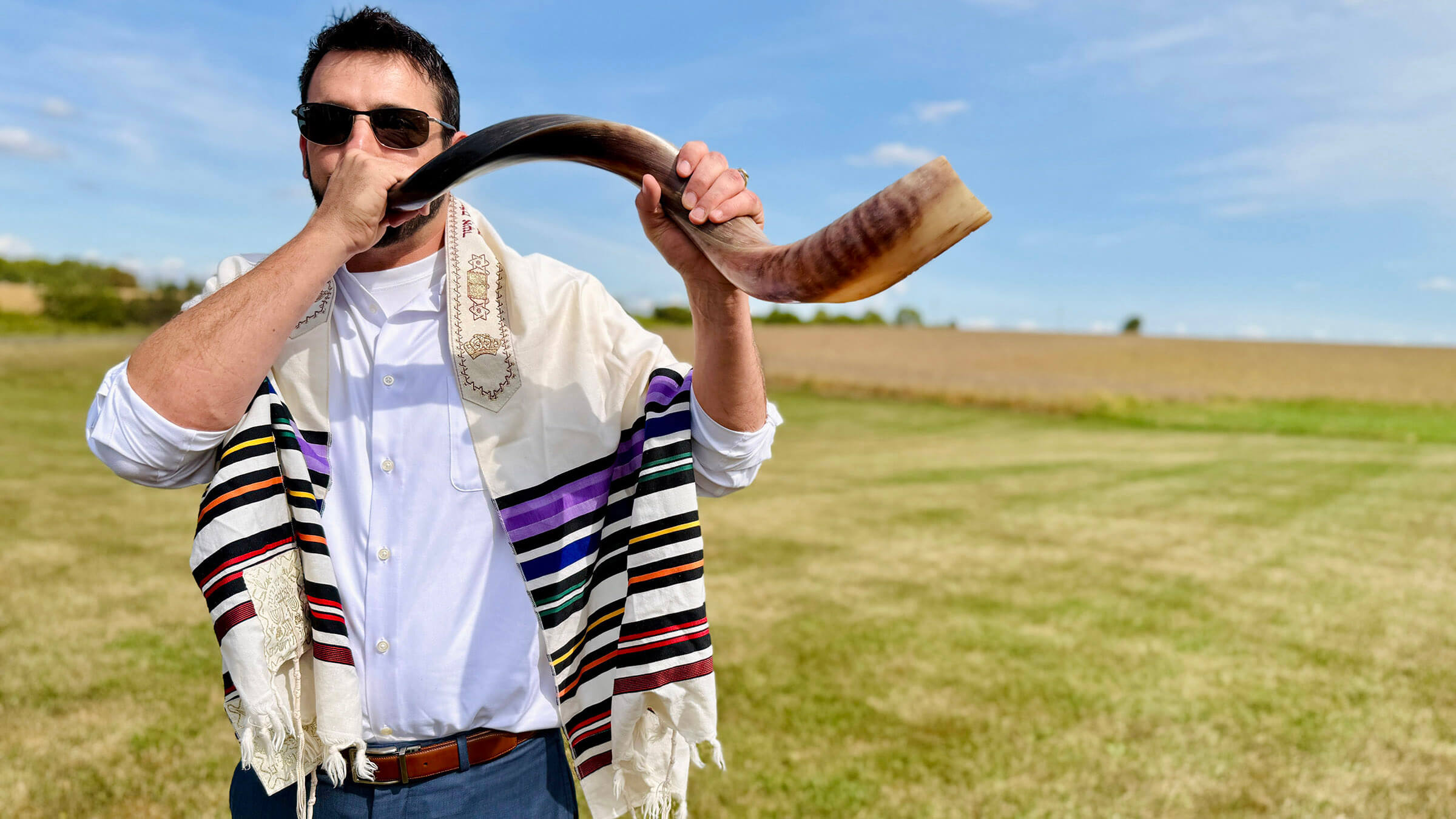 Nik Jakobs blows the shofar at a unique Rosh Hashanah service held in a field in northwestern Illinois.