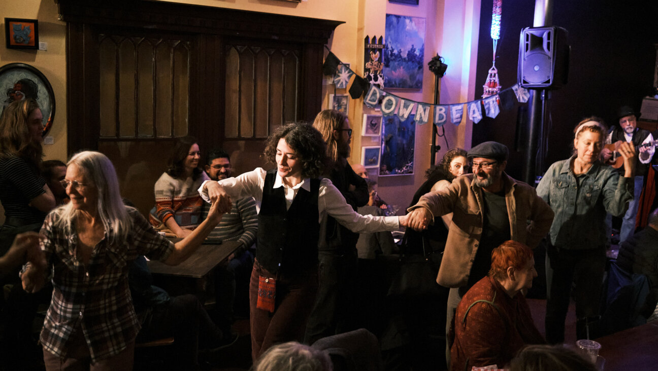 People dancing on the first night of the Richmond Yiddish Week festival, Jan. 10, at the Gold Lion Community Café in Richmond, Virginia. 