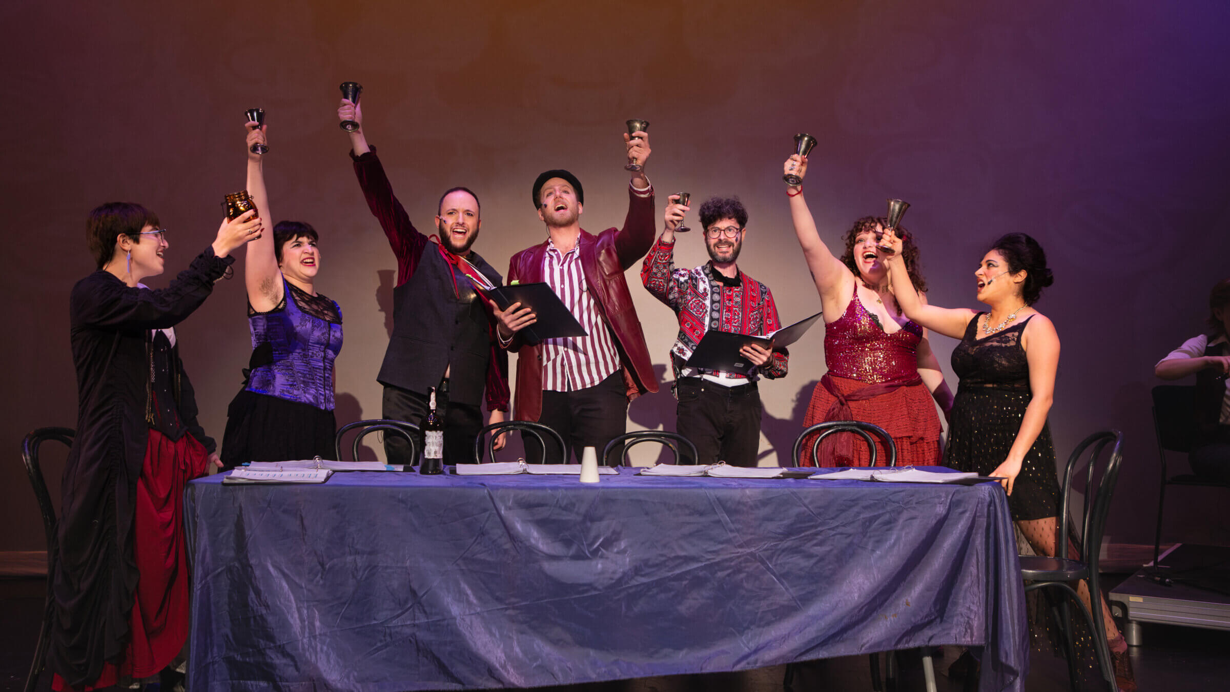 The Seven Sinners say "L'chaim" to their vices. 